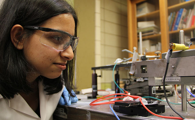 Graduate student Eeshita Manna examines OLED Array 